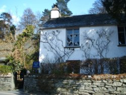 Dove Cottage, the Home of poet William Wordsworth, at Grasmere, The Lake District. Wallpaper