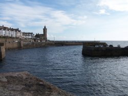 Porthleven, Cornwall. The harbour mouth, the clock tower is part of the old library. Wallpaper