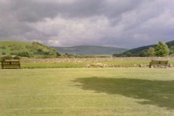 View of hills and river bank from park in Burnsall, North Yorkshire - June, 2005 Wallpaper