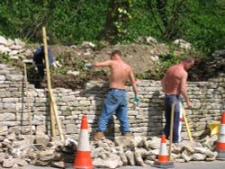 Repairing stone wall, Bisley, Gloucestershire, Cotswolds. Wallpaper