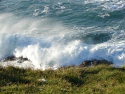 Waves storming a rock, near Porthcothan Bay, december 2005, Cornwall. Wallpaper