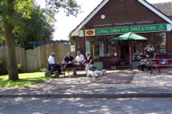 Locals enjoy a coffee at the post office,  New road, Cutnall green