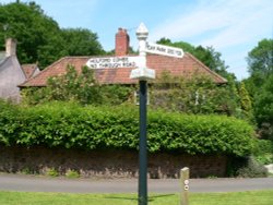A sign post in the village of Holford on the edge of the Quantock hills in somerset
