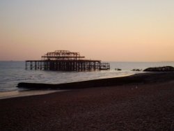 The old pier, Brighton beach on a summers evening. Wallpaper