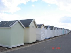 Serial Cloak houses at beach. Felixstowe, Suffolk Wallpaper