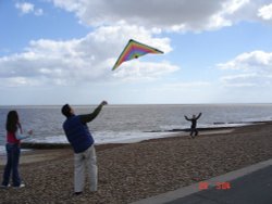 Felixstowe, Suffolk.
Kite Flying at beach... Wallpaper