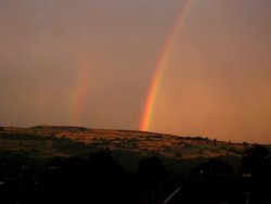 Rainbows above Ilkley Moor viewed from Utley, Keighley, West Yorkshire.