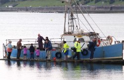Fishing boat returning - Colwyn Bay, N Wales. Wallpaper