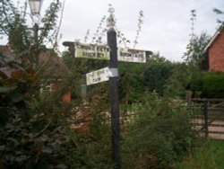 Intriguing little fingerpost outside a farm on a country road near Bromyard, Herefordshire