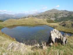 Stickle Tarn set high up on Stickle Pike near Ulpha, Duddon valley.
