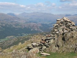 Top of Stickle Pike near Ulpha, looking to Esk Pike, Bowfell and Crinkle Crags.