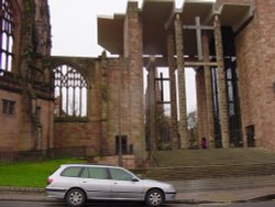 The exterior of the old cathedral, on the left, meets the new Coventry Cathedral, Winter 2002. Wallpaper