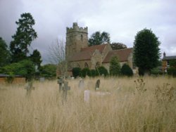 St. Peters Parish Church in Dunchurch Village from the surrounding cemetery looking southwest.