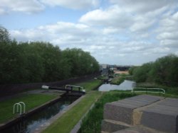 Twelve step lock stairway in Oldbury, West Midlands, carrying canal beneath M5 near junction 2.