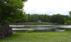 An ornamental temple across the lake at Clumber, Nottinghamshire. Wallpaper