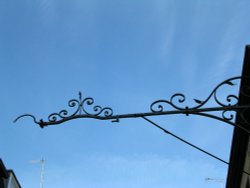 Crown Inn at Stamford, Lincolnshire - detail of ironwork of former inn sign hanger Wallpaper