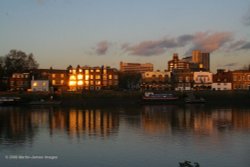 London River Thames, Hammersmith, evening light on the riverside with reflections. Wallpaper