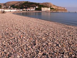 The beach and promenade at Llandudno, North Wales. Wallpaper