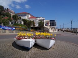 Spa Pavilion and boats used as flower planters at Felixstowe, Suffolk. Wallpaper
