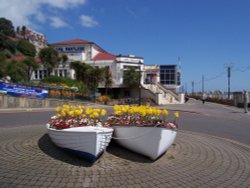 Spa Pavilion and boats used as flower planters at Felixstowe, Suffolk. Wallpaper