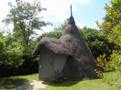 Ice House at Scotney castle, Kent.  This is thatched with heather. Wallpaper