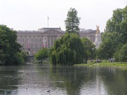 A view of Buckingham Palace across the St James Park lake, central London. Wallpaper