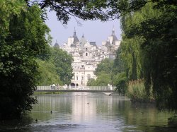 A glimpse of Horseguards Parade across the lake in St James Park, central London. Wallpaper