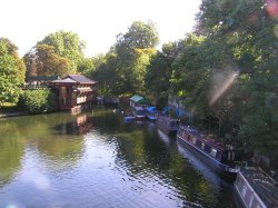 Chinese restaurant and barges moored on the Regents Canal in central London, close to London Zoo. Wallpaper
