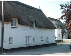 Thatched cottages in the leat. Stratton, Cornwall Wallpaper