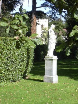 Brodsworth Hall, South Yorkshire. Garden statue and church