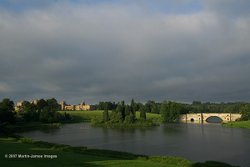 Blenheim Palace, lake, bridge, and island, dawn, midsummer Wallpaper