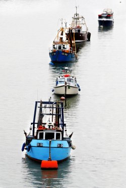 Fishing boats moored off Canvey Island in Benfleet Creek