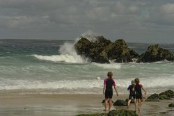 Playing in the surf at St Ives in Cornwall Wallpaper
