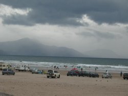 Surfers on Inch Beach in Dingle, Ireland
