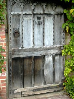 An old door (1680) in the garden wall at Kedleston Hall, Derbyshire