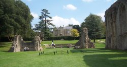 The ruins, with Palace House in the background, Glastonbury Abbey, Somerset Wallpaper