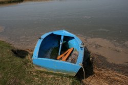 Lone boat on the River Blyth, Suffolk