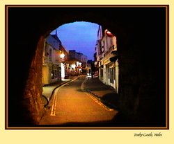 Tenby through castle archway Wallpaper