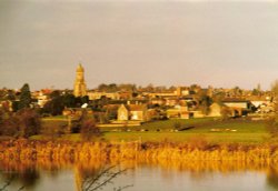 View across lake to Irthlingborough Wallpaper