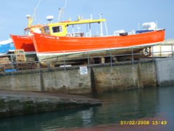 Lifeboats on dock Seahouses Wallpaper