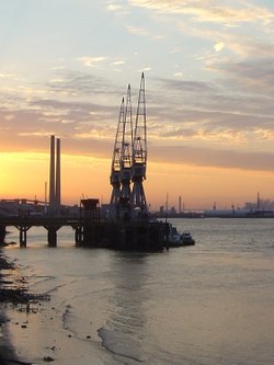 Sunset and Cranes on the Thames at Gravesend.