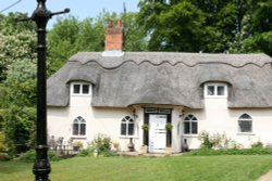 Thatched village cottage Wallpaper