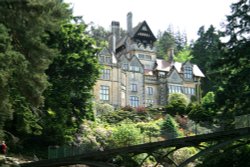 The Iron Bridge and Main House, Cragside Estate, nr Rotherbury, Northumberland. Wallpaper