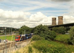 Sheffield supertram going into Meadowhall with the (now demolished) Tinsley towers and the M1 Wallpaper