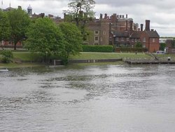 View of Hampton Court Palace while crossing the Thames Wallpaper