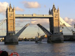 Tower Bridge opens to let through a masted ship Wallpaper