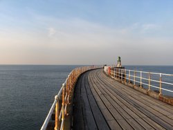 A silent stroll to the lighthouse - Whitby harbour entrance Wallpaper
