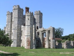 The grand turreted Tudor gatehouse built from the Abbey Church Wallpaper