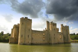 Gathering clounds encircle Bodiam Castle in Sussex Wallpaper