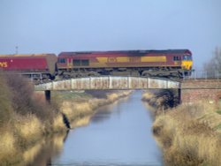 Freight train passing over the Canal bridge at Broomfleet Wallpaper